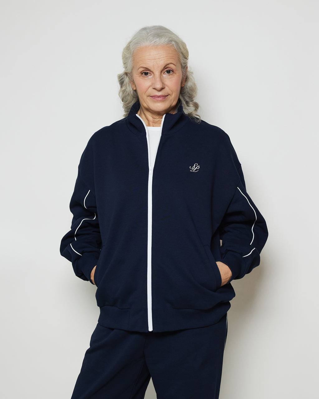 Бомбер вільного крою на блискавці з білими кантами