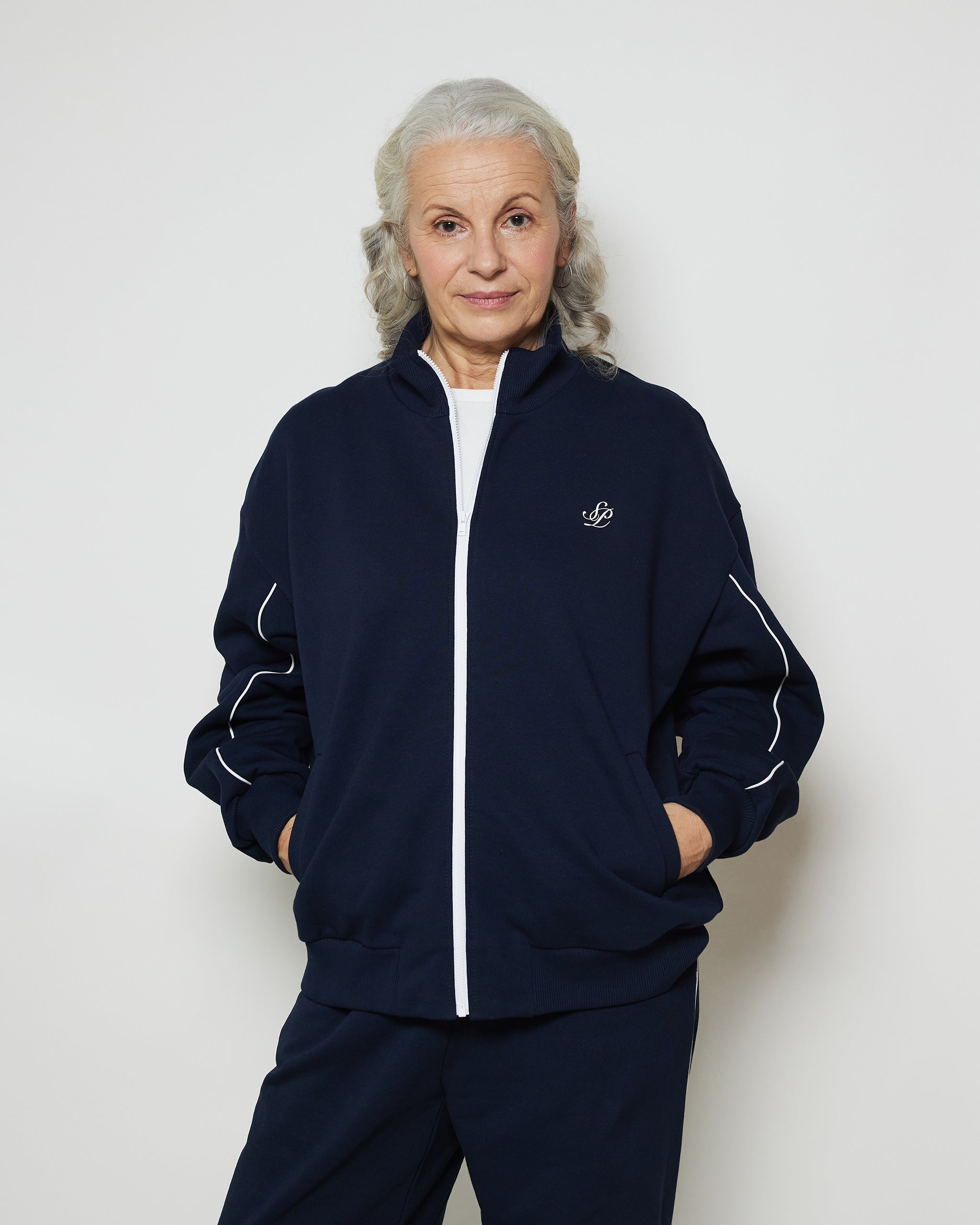 Бомбер вільного крою на блискавці з білими кантами