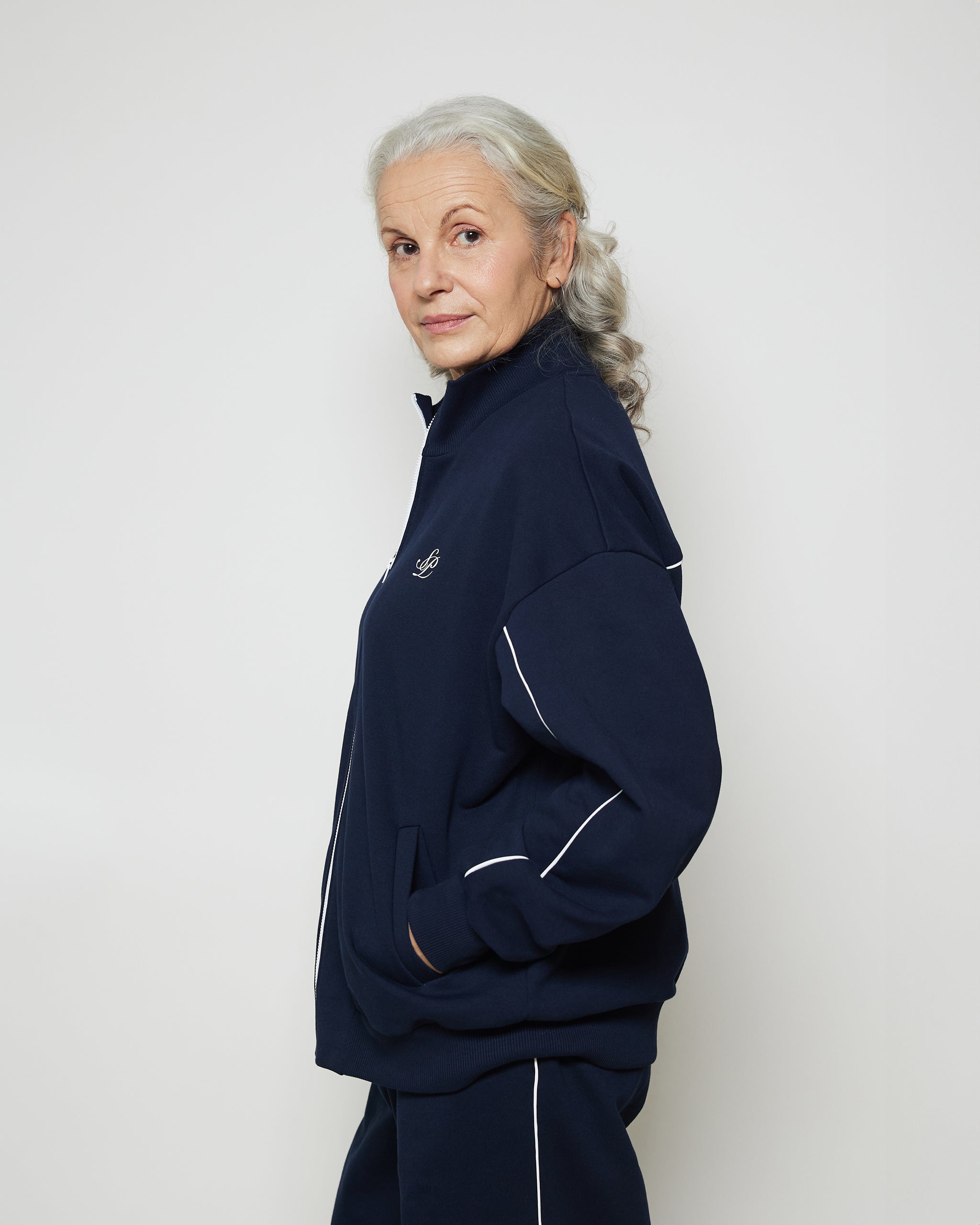 Бомбер вільного крою на блискавці з білими кантами