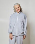 Бомбер вільного крою на блискавці з білими кантами