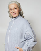 Бомбер вільного крою на блискавці з білими кантами