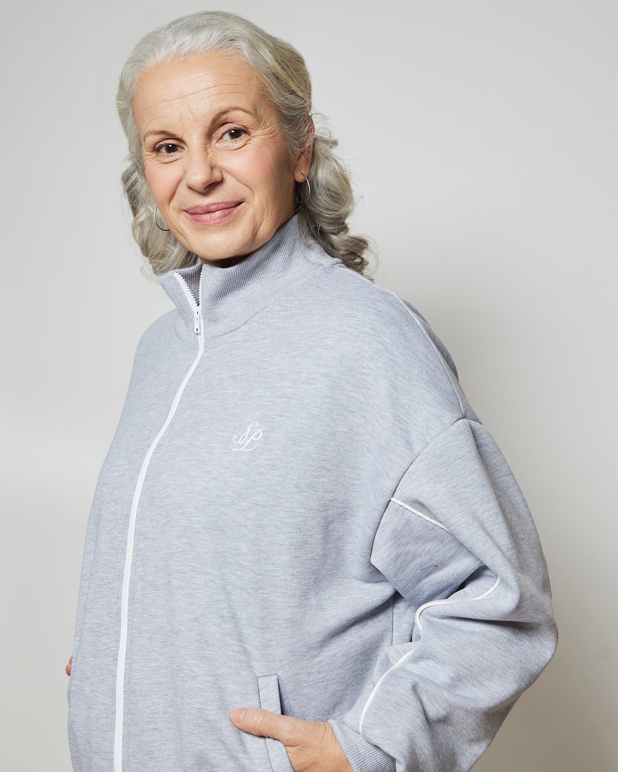 Бомбер вільного крою на блискавці з білими кантами